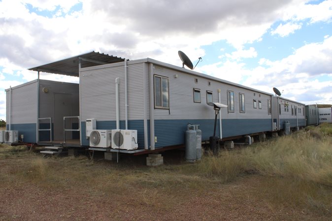 View a 20 Man Camp With Kitchen, Cold Room, Laundry and Recreation Shed Plus Weigh Bridge available via auction.