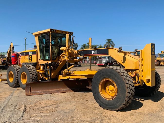 Yellow Caterpillar 14H Articulated Motor Grader via auction.