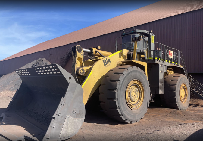 Yellow Komatsu WA900 loader