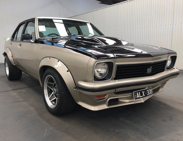 View black and gold 1977 Holden Torana sold car at our previous auction.