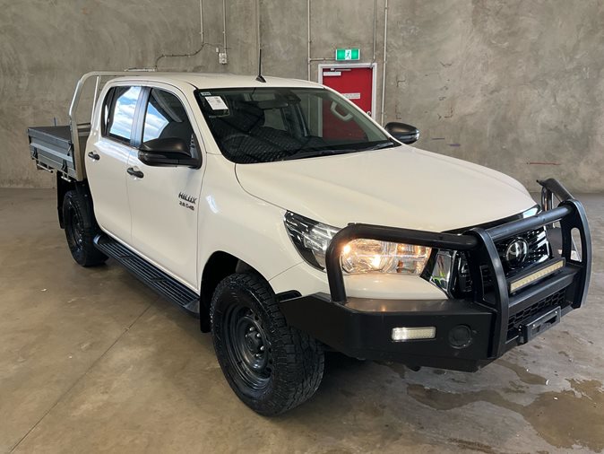 View a white 2019 Toyota Hilux available via auction.